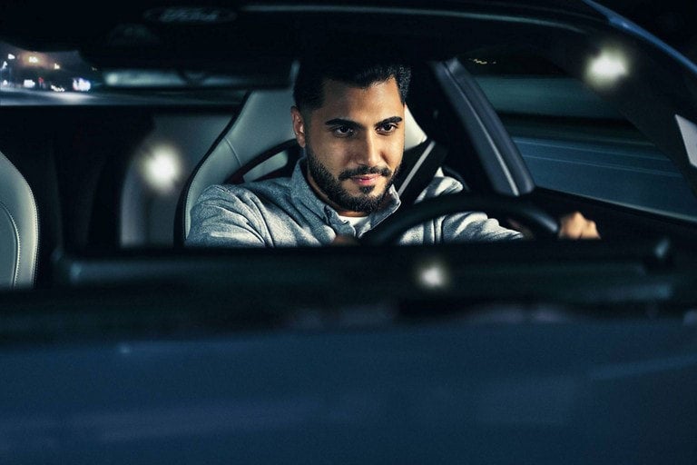 Person sitting in the driver’s seat of a parked 2024 Ford Mustang® coupe | Woody Ford in Madill OK